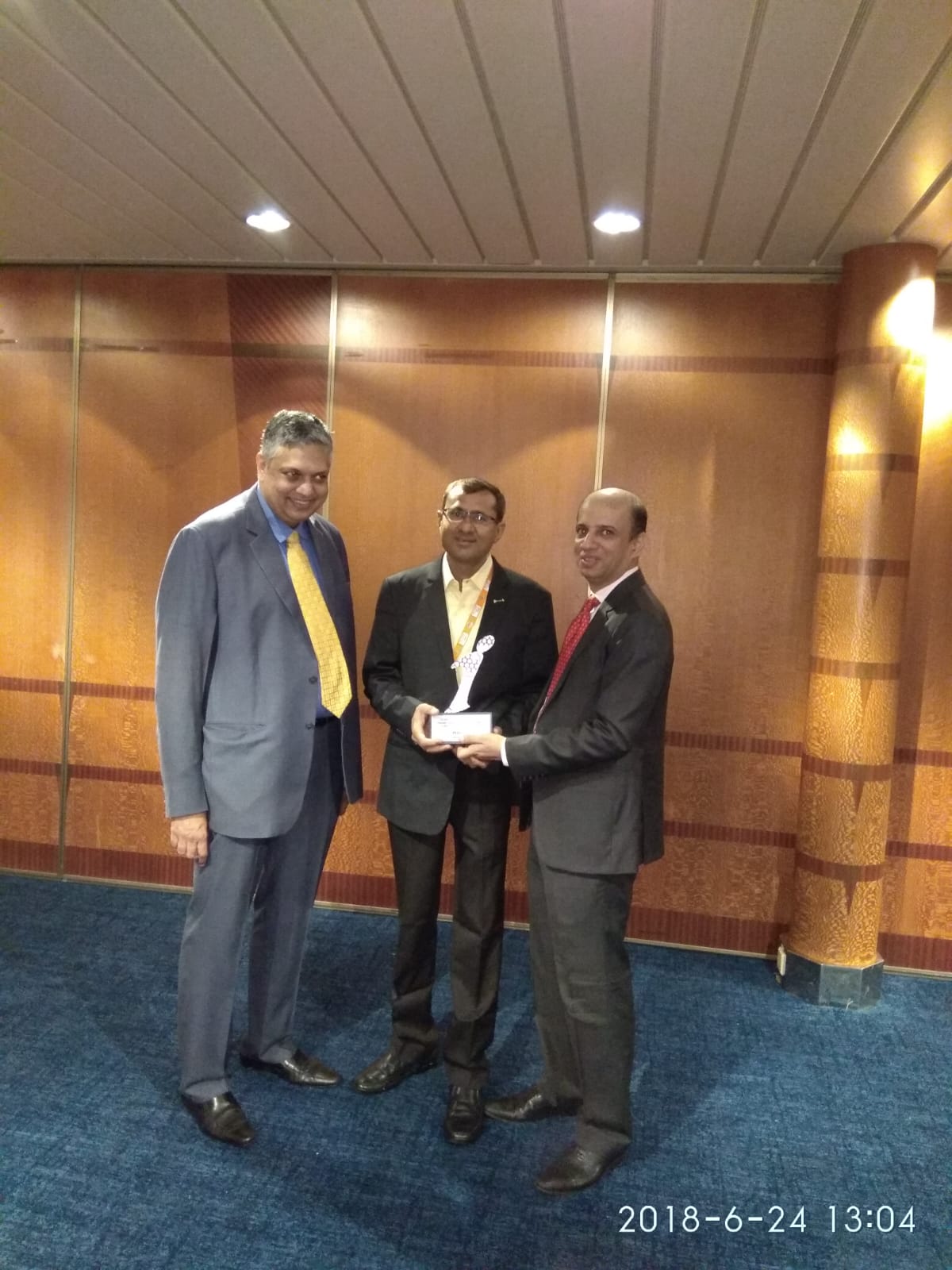Miteshkumar Patel receiving award from ICICI Heads